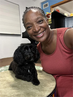 cute musical dog playing percussion